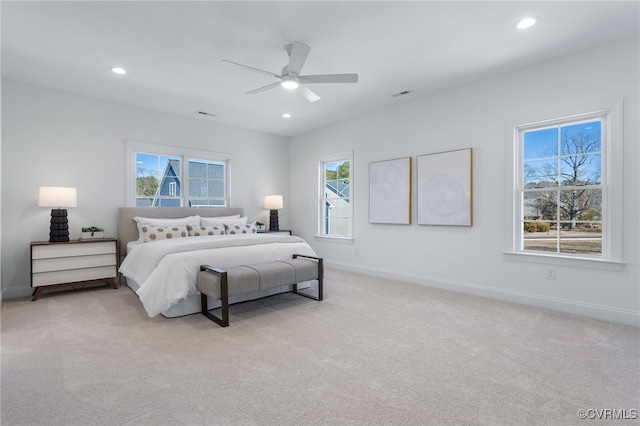 bedroom featuring visible vents, light carpet, recessed lighting, and baseboards