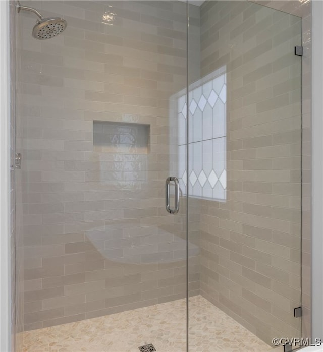 bathroom featuring a stall shower