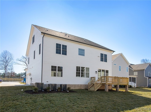rear view of house featuring stairway, cooling unit, and a yard