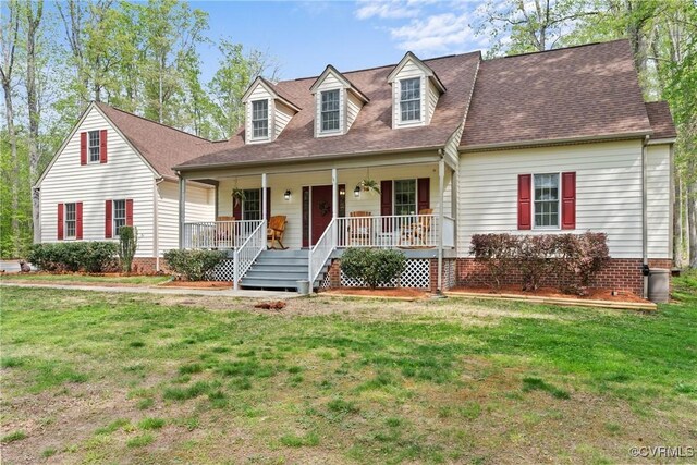 13032 Beech Creek Ln, Ashland, VA 23005 - new england style home with covered porch, a front lawn, and roof with shingles