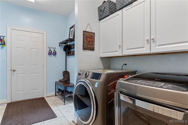 13032 Beech Creek Ln, Ashland, VA 23005 - washroom featuring cabinet space, washing machine and clothes dryer, light tile patterned floors, and baseboards