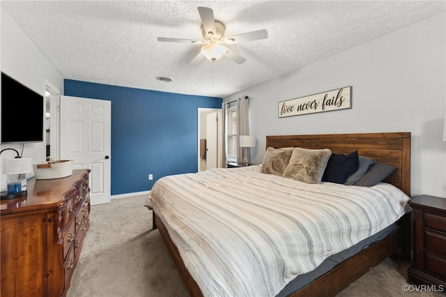 bedroom featuring baseboards, a ceiling fan, a textured ceiling, and carpet