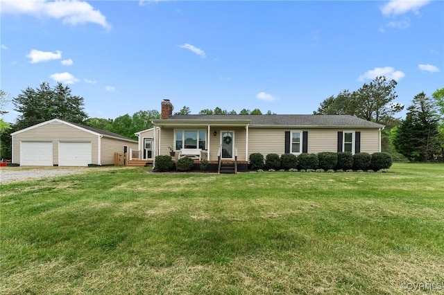 single story home with a chimney, an outbuilding, a front lawn, and a garage