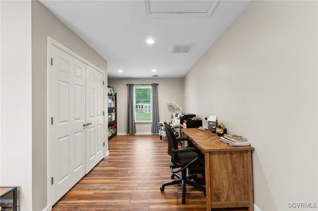 home office featuring baseboards, visible vents, wood finished floors, and recessed lighting