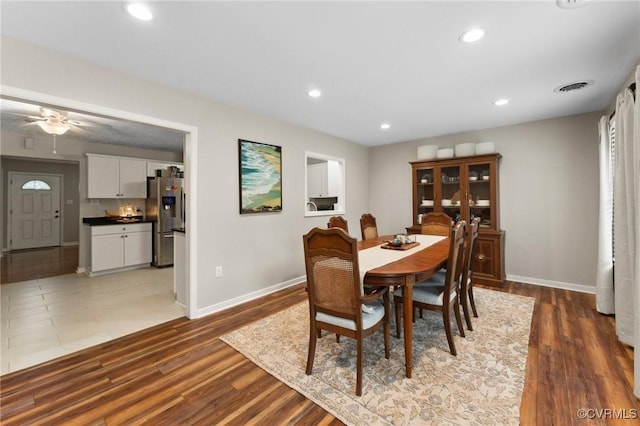 dining space featuring recessed lighting, ceiling fan, wood finished floors, and baseboards
