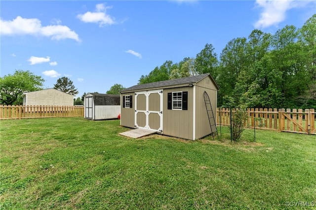 view of shed with a fenced backyard