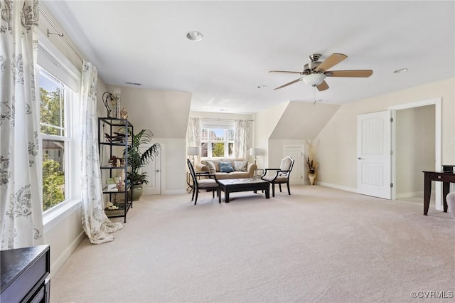 sitting room with carpet floors, a ceiling fan, baseboards, and visible vents