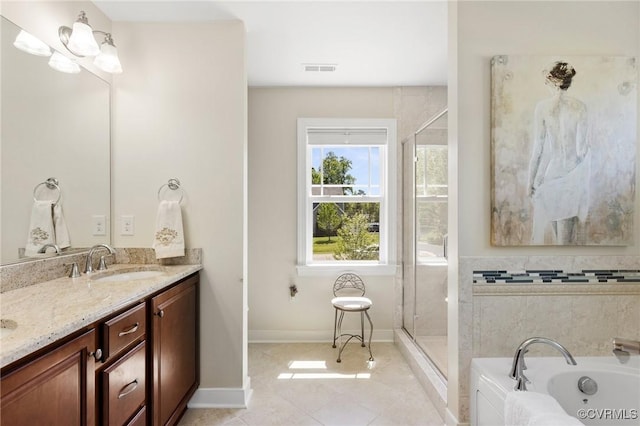 full bath featuring a sink, a garden tub, a shower stall, and double vanity