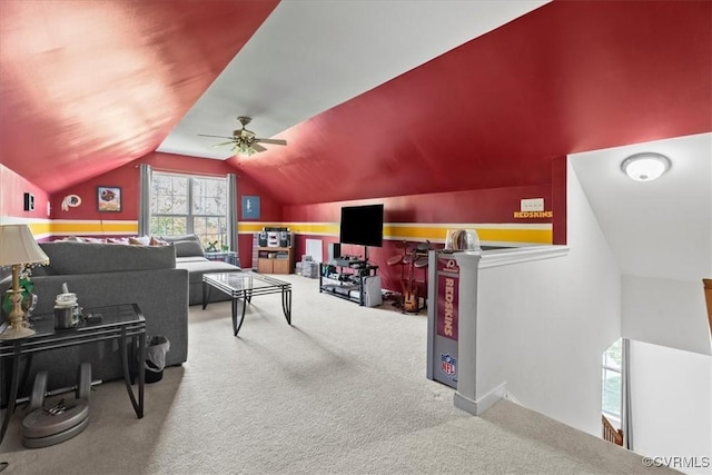 playroom featuring a ceiling fan, vaulted ceiling, and carpet floors