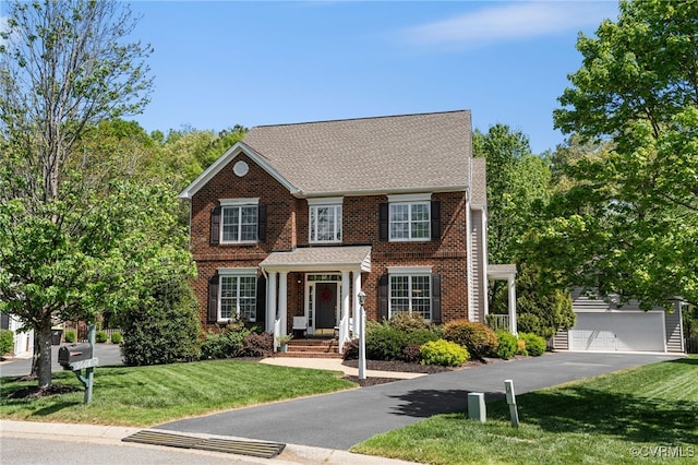 view of front of house with brick siding and a front lawn