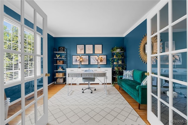 office area with crown molding, french doors, and wood finished floors