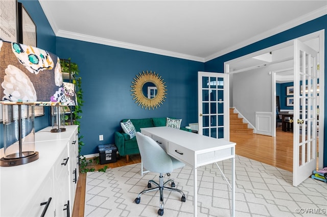 office featuring baseboards, ornamental molding, french doors, and light wood-type flooring
