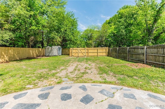 view of yard featuring a patio and a fenced backyard