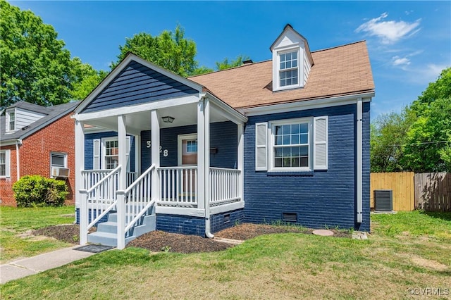 bungalow-style house featuring crawl space, fence, and a front yard