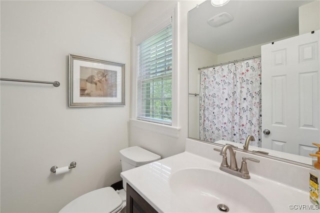 bathroom with vanity, toilet, and a shower with curtain