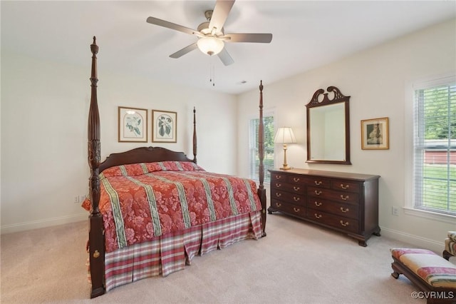bedroom with baseboards, light carpet, and ceiling fan