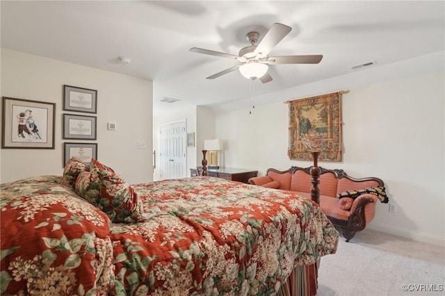 carpeted bedroom with visible vents, a ceiling fan, and baseboards