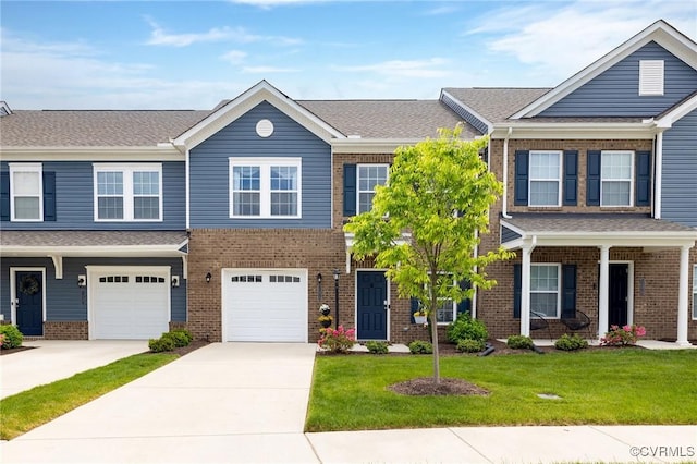 11513 Dunmore Mill Ter Unit 3-4, Chester, VA 23831 - townhome / multi-family property with concrete driveway, brick siding, a front yard, and a garage