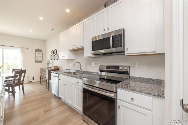 11513 Dunmore Mill Ter Unit 3-4, Chester, VA 23831 - kitchen with white cabinets, appliances with stainless steel finishes, a sink, recessed lighting, and light wood-type flooring