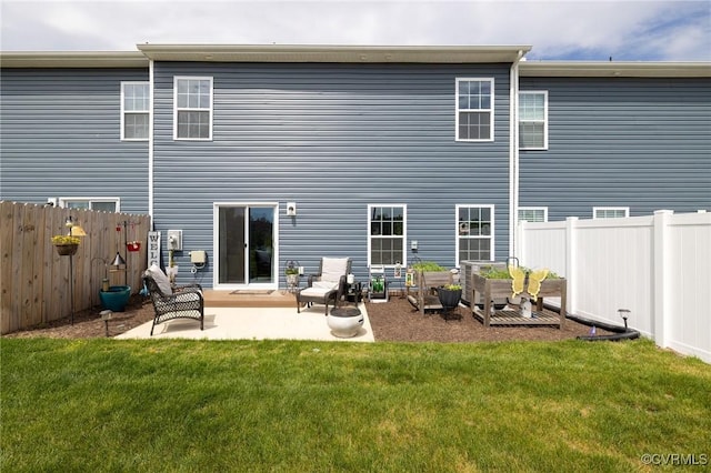 11513 Dunmore Mill Ter Unit 3-4, Chester, VA 23831 - back of property with a yard, a fenced backyard, and a patio area