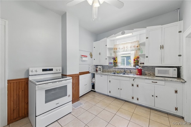 kitchen featuring white appliances, open shelves, white cabinets, a wainscoted wall, and a sink
