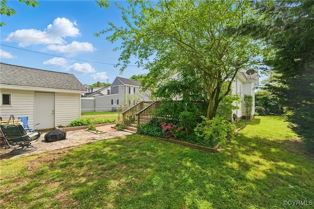 view of yard with a fire pit and a patio