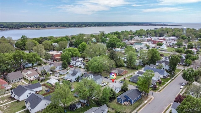 birds eye view of property with a residential view and a water view