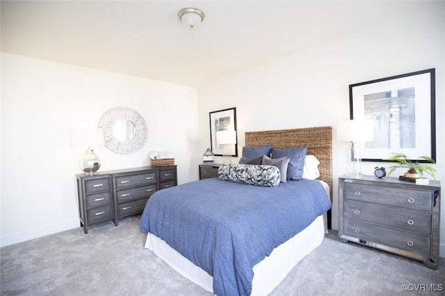 carpeted bedroom with baseboards