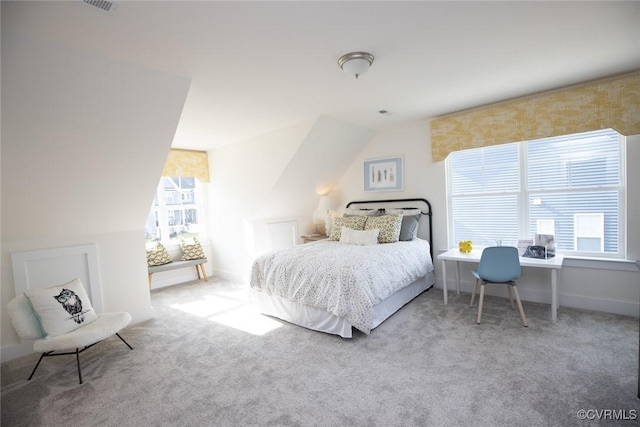 bedroom featuring multiple windows and carpet