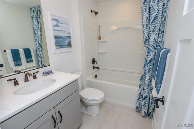 full bathroom with toilet, shower / tub combo, and vanity