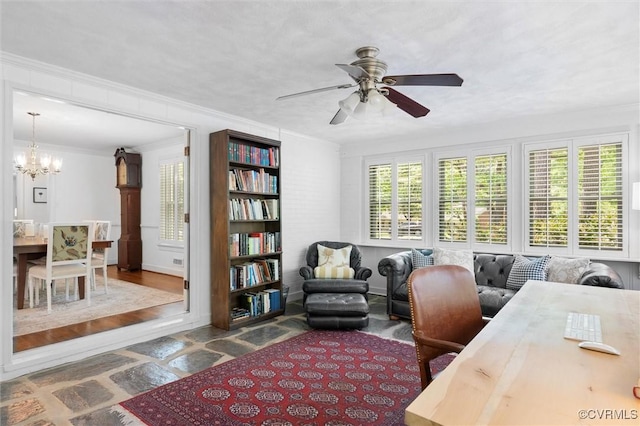 office area featuring ornamental molding and ceiling fan with notable chandelier