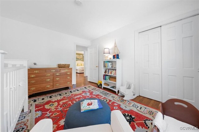 bedroom featuring a closet and wood finished floors