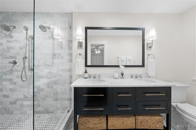 full bath featuring double vanity, tiled shower, and a sink