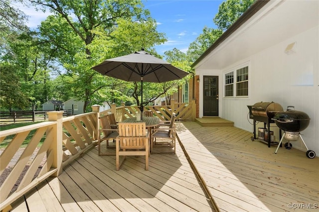 wooden deck with outdoor dining space