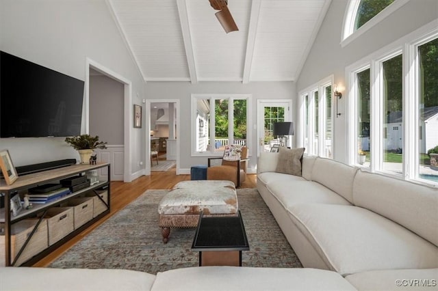 living room with beam ceiling, wood ceiling, high vaulted ceiling, and wood finished floors