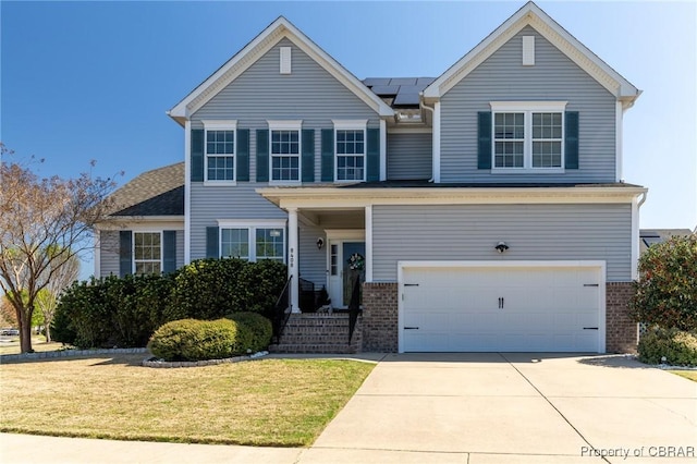 traditional-style house featuring roof mounted solar panels, a front lawn, an attached garage, and brick siding
