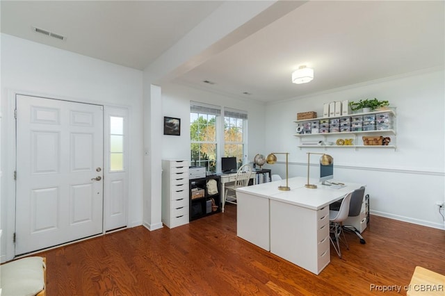 office space with baseboards, visible vents, and dark wood-style flooring