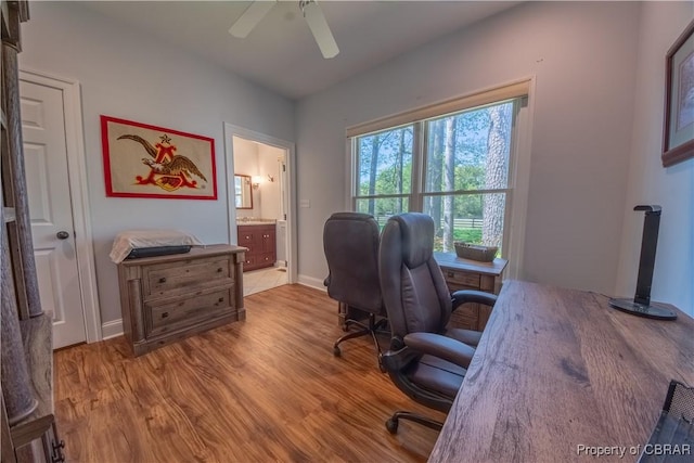 office space with wood finished floors, ceiling fan, and baseboards