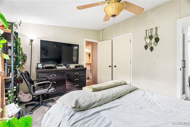 carpeted bedroom featuring a ceiling fan