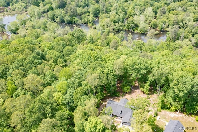 aerial view featuring a water view and a view of trees