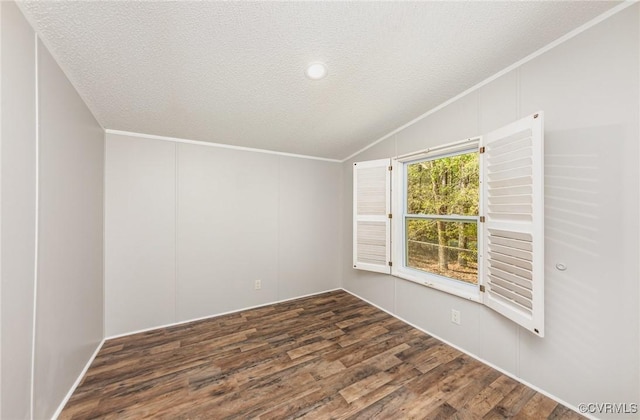 1223 Ullainee Rd, Essex, VA 22436 - spare room featuring vaulted ceiling, wood finished floors, a textured ceiling, and ornamental molding