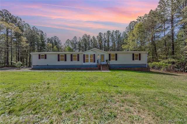 1223 Ullainee Rd, Essex, VA 22436 - manufactured / mobile home featuring a yard and crawl space