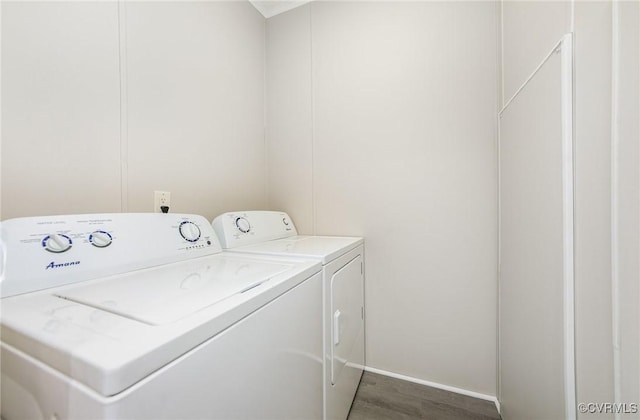 1223 Ullainee Rd, Essex, VA 22436 - clothes washing area with washer and dryer, wood finished floors, and baseboards