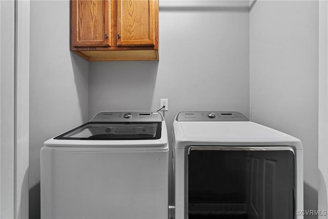laundry area featuring cabinet space and washer and dryer