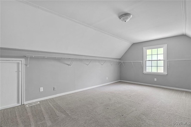 bonus room featuring baseboards, visible vents, carpet, and lofted ceiling