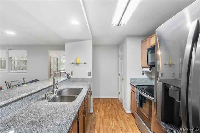 3218 Matilda Cv Unit 104, Henrico, VA 23294 - kitchen with appliances with stainless steel finishes, light wood-style flooring, light stone counters, brown cabinetry, and recessed lighting