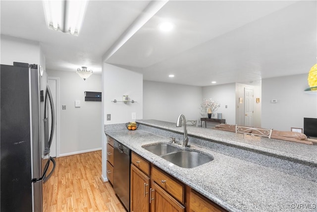 3218 Matilda Cv Unit 104, Henrico, VA 23294 - kitchen featuring stainless steel appliances, light wood-type flooring, brown cabinetry, light stone counters, and recessed lighting