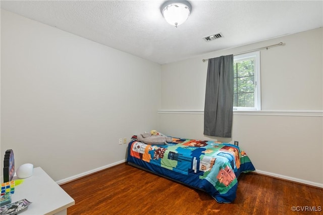 3218 Matilda Cv Unit 104, Henrico, VA 23294 - bedroom with wood finished floors, baseboards, and a textured ceiling