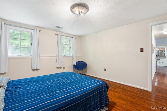 3218 Matilda Cv Unit 104, Henrico, VA 23294 - bedroom with wood finished floors, a textured ceiling, and baseboards