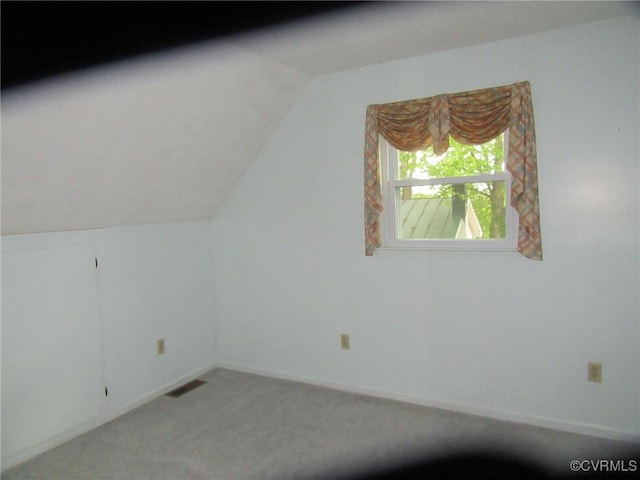 7704 Quail Hollow Rd, Mc Kenney, VA 23872 - additional living space with visible vents, carpet flooring, vaulted ceiling, and baseboards